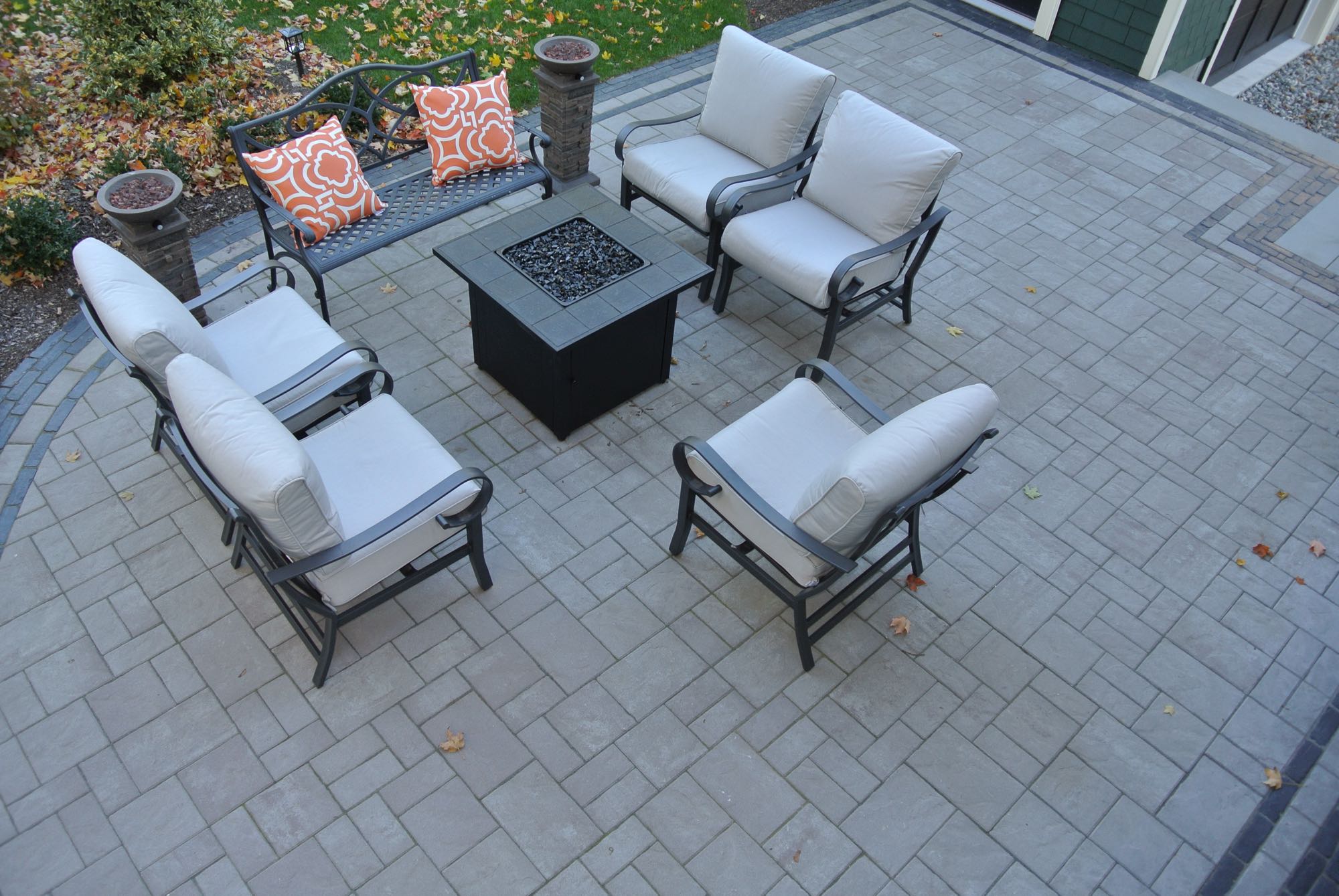 Greene Street project; overhead view of small paver patio with fire pit and cushioned seating