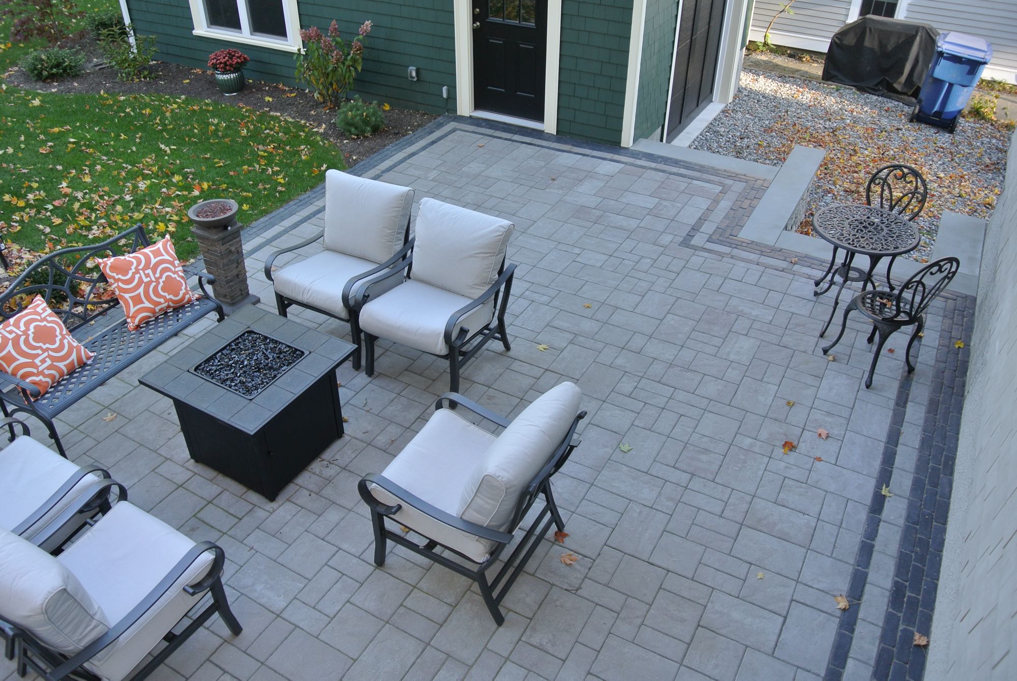 Greene Street project; overhead view of small paver patio with fire pit and cushioned seating and bistro set