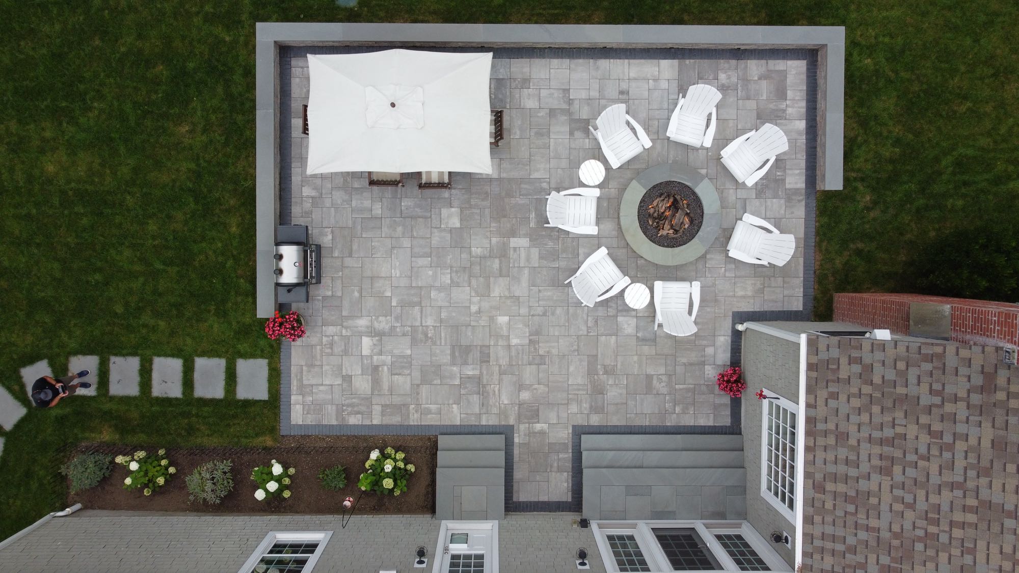 Half Mile road project; overhead view of small paver patio with stone wall, stone stairs, and a stone walkway