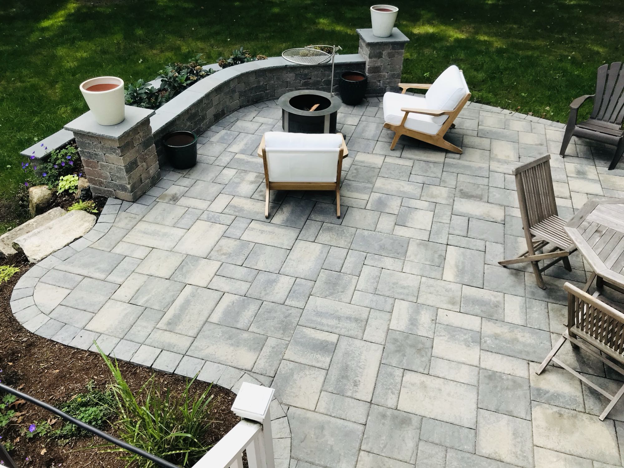 Prides Crossing project; small paver patio with stone wall