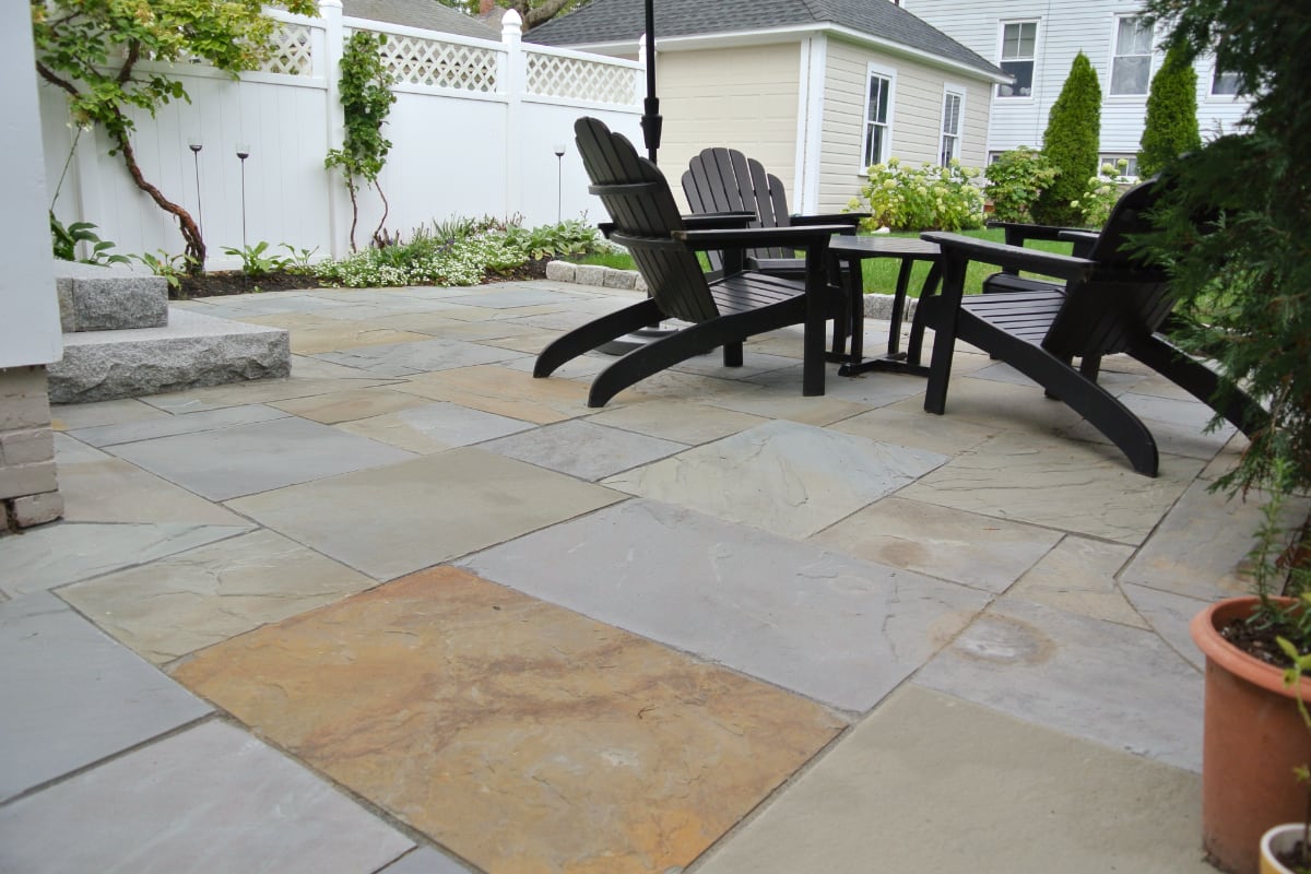 Prospect Street project; natural stone patio with Adirondack chairs