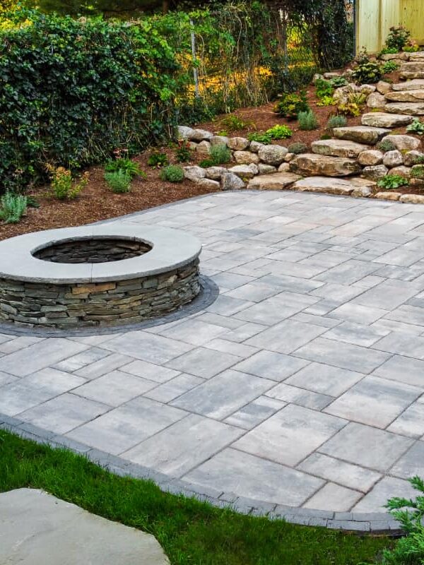 Wolcott Ave project; overhead view of paver patio with two levels, built-in fire pit, and natural stone stair walkway