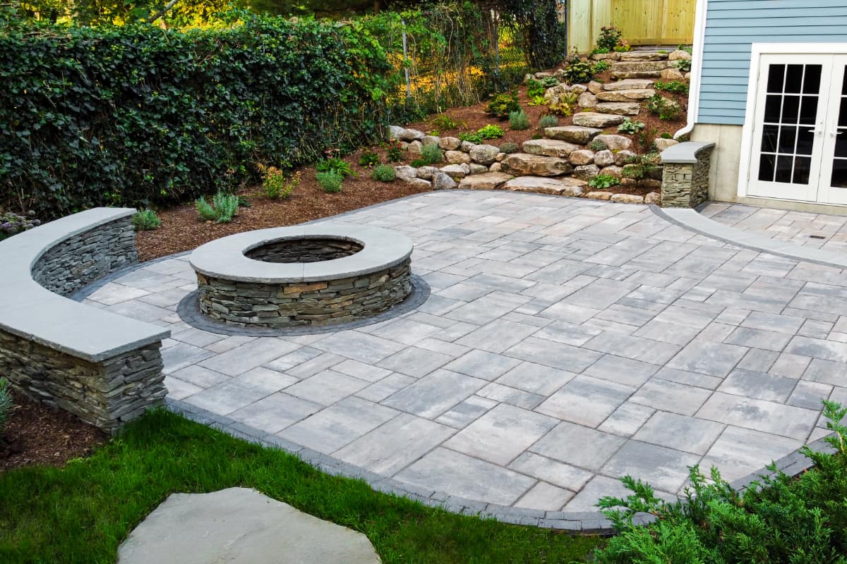 Wolcott Ave project; overhead view of paver patio with two levels, built-in fire pit, and natural stone stair walkway