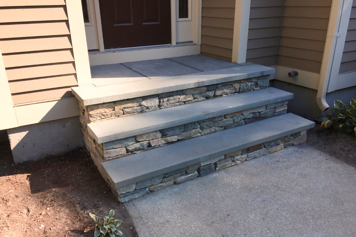 Sage Trails project; stone stairs leading to a stone porch and front door