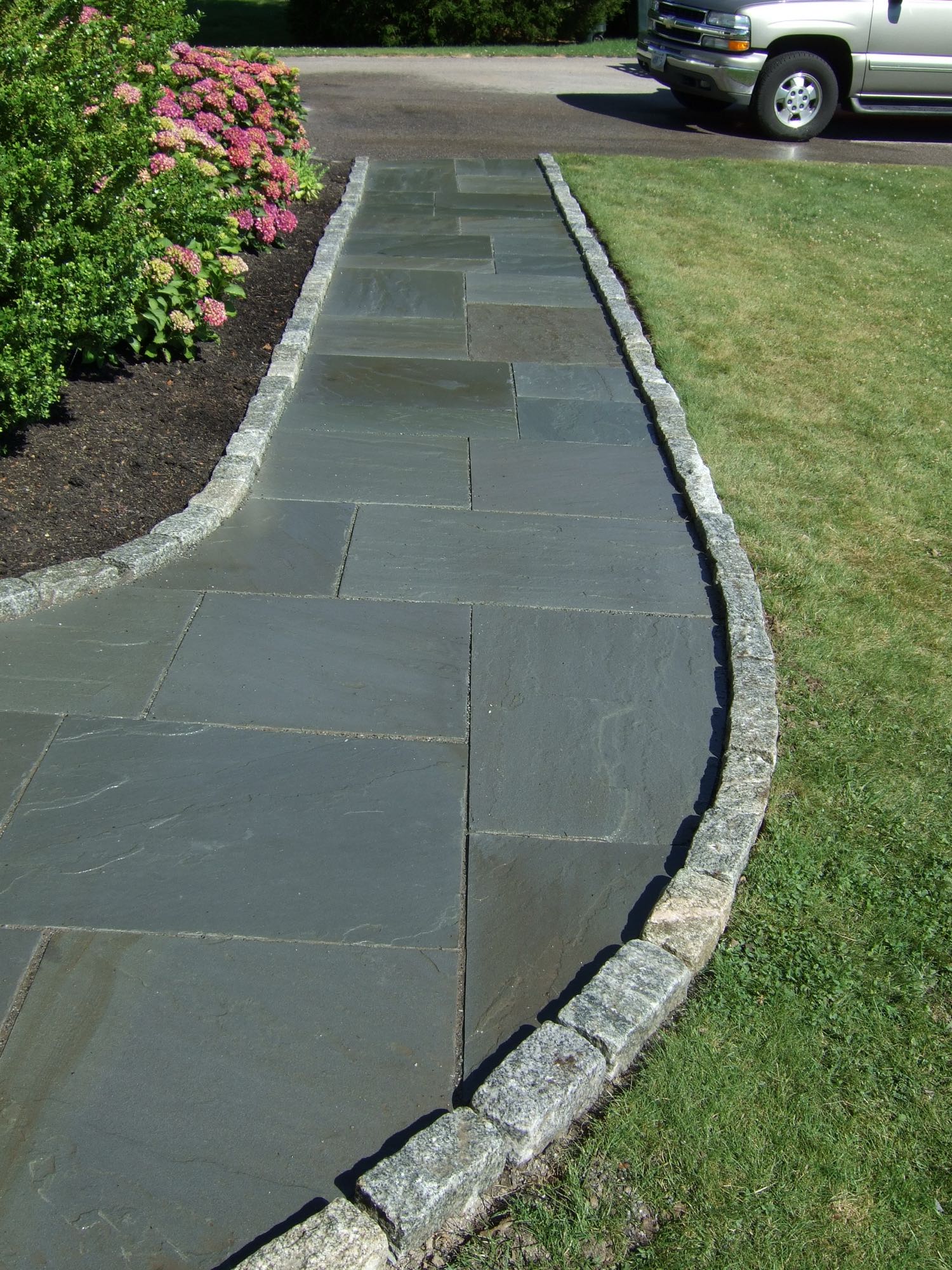 Great Island project; natural stone walkway bordered by stone bricks