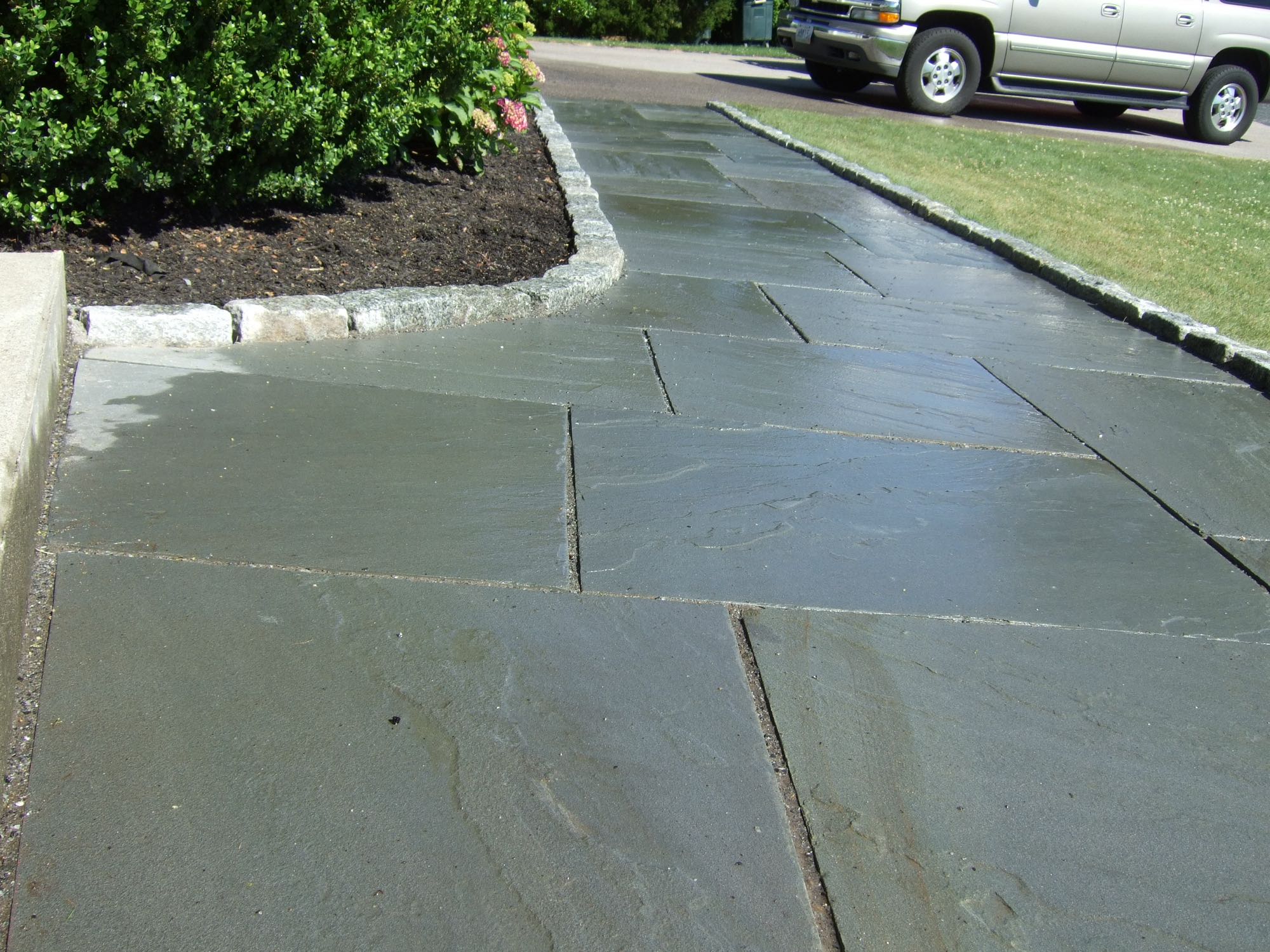 Great Island project; natural stone walkway bordered by stone bricks