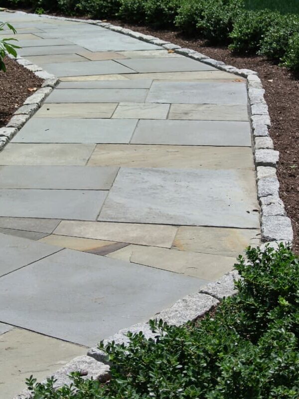 Larkspur project; natural stone walkway bordered by stone bricks