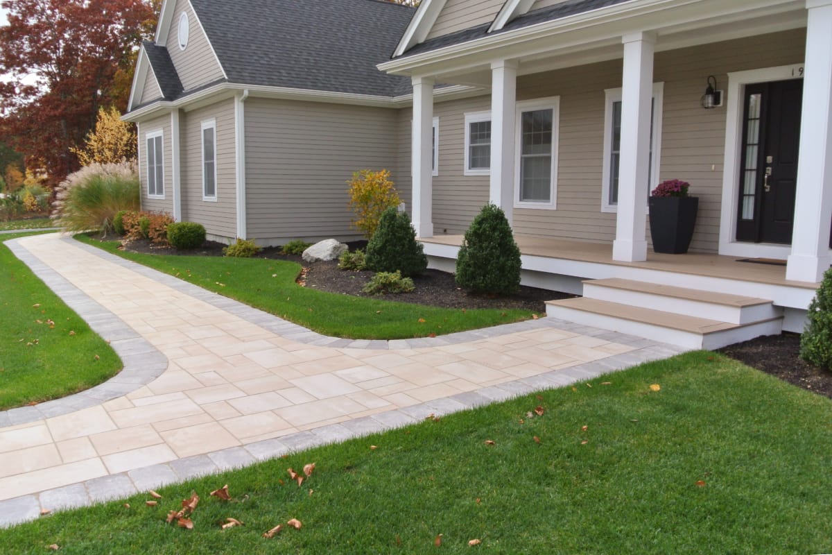 Rodman Lane project; paver walkway with border from street to front door and along house around to garage