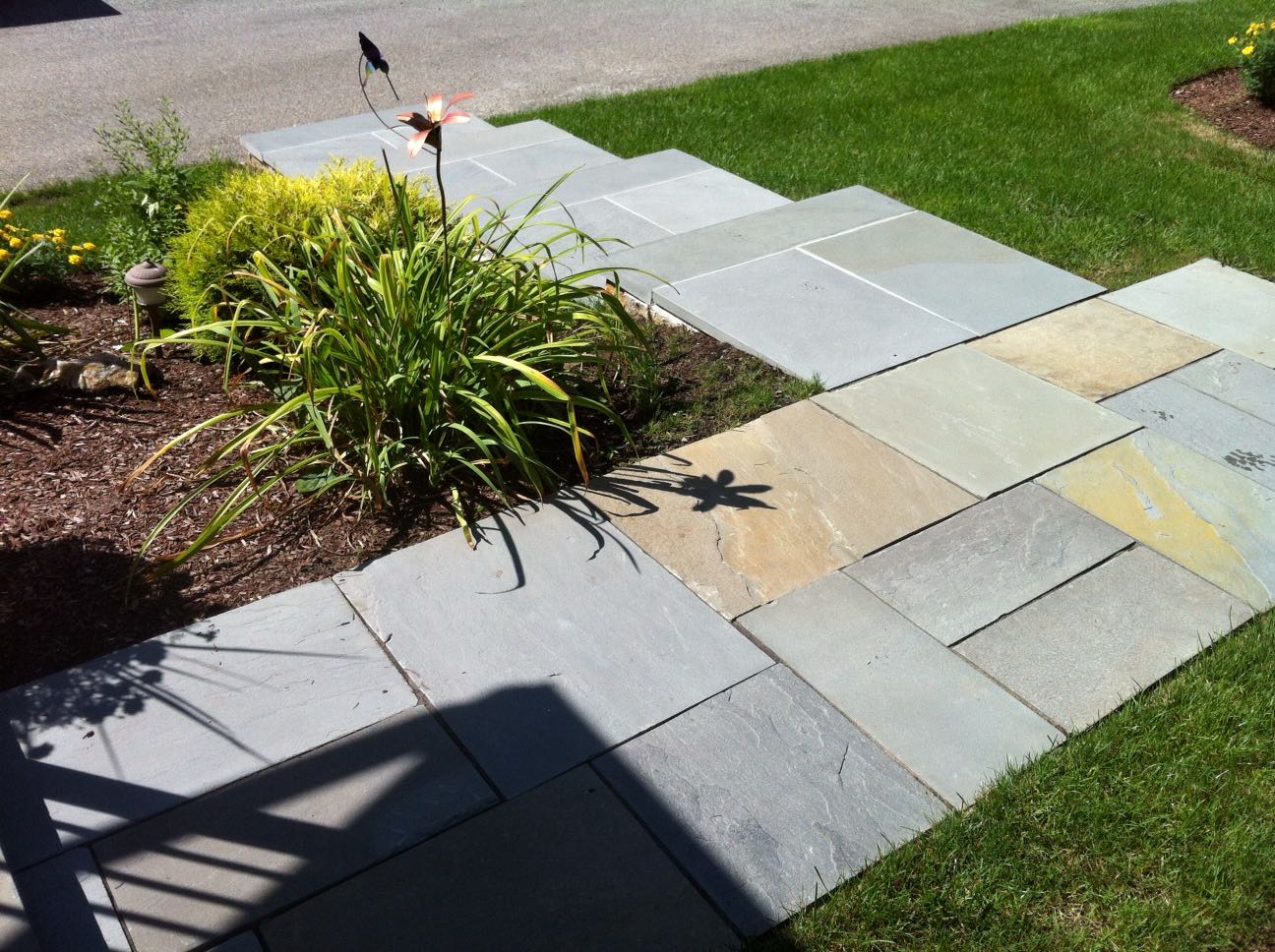 North Providence project; natural stone walkway and walkway stairs leading down to driveway