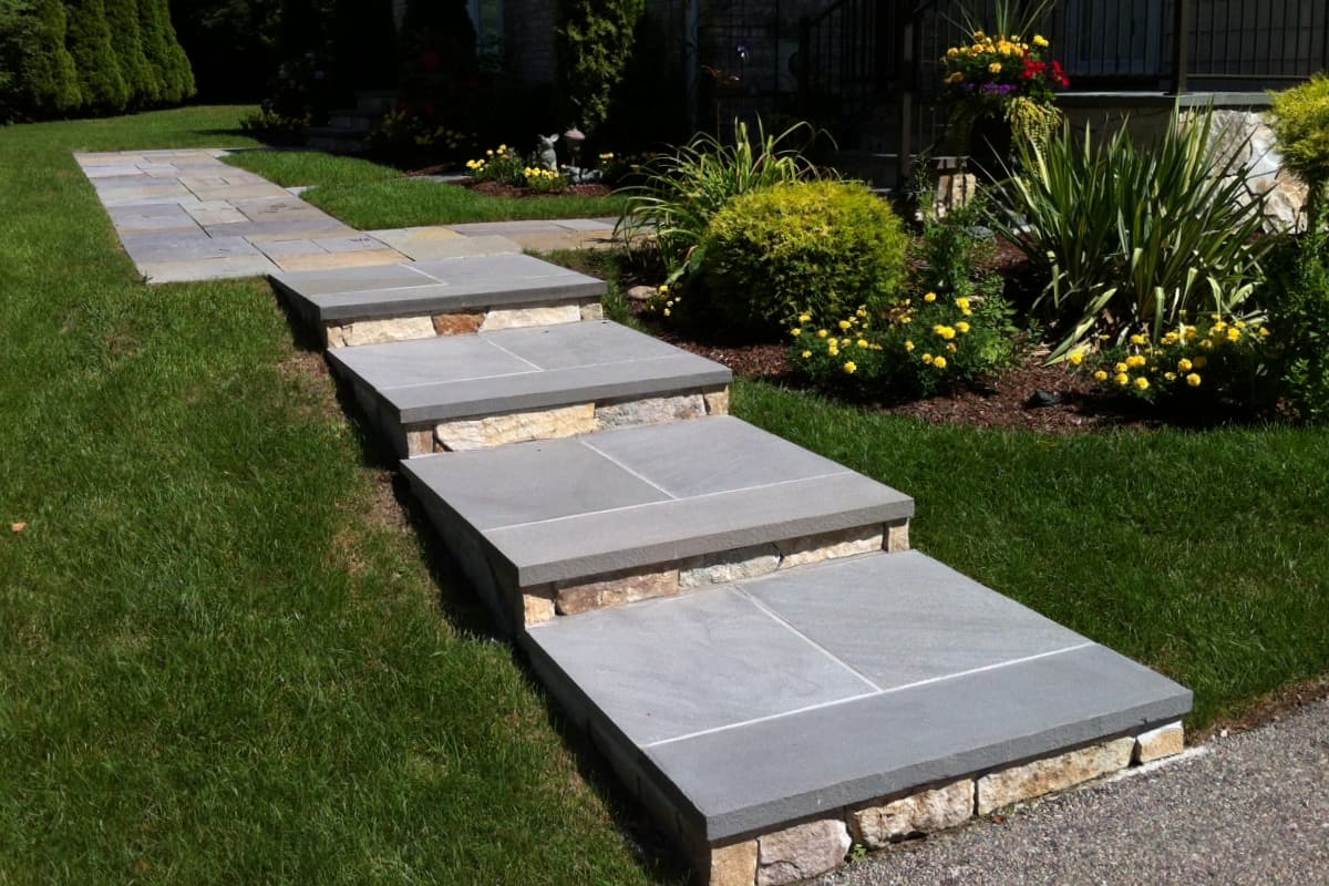 North Providence project; natural stone walkway and walkway stairs leading down to driveway