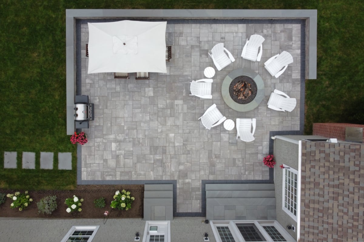 overhead view of a patio with built-in fire pit