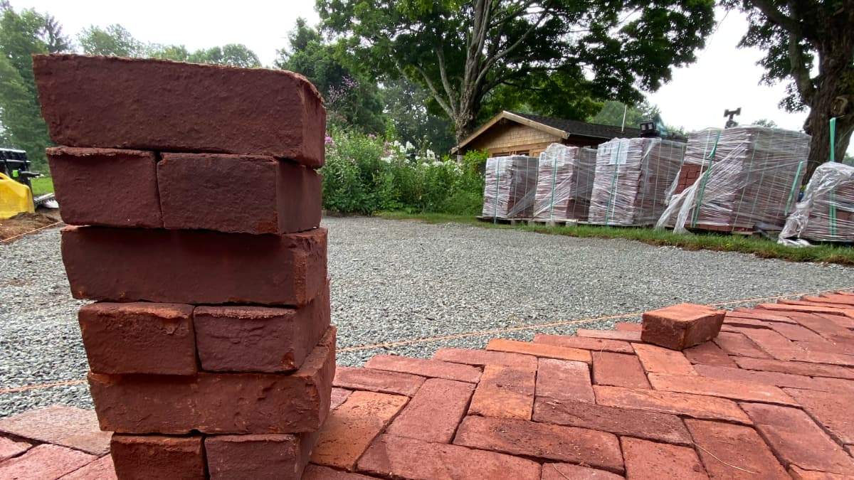 bricks stacked and laid out in patio