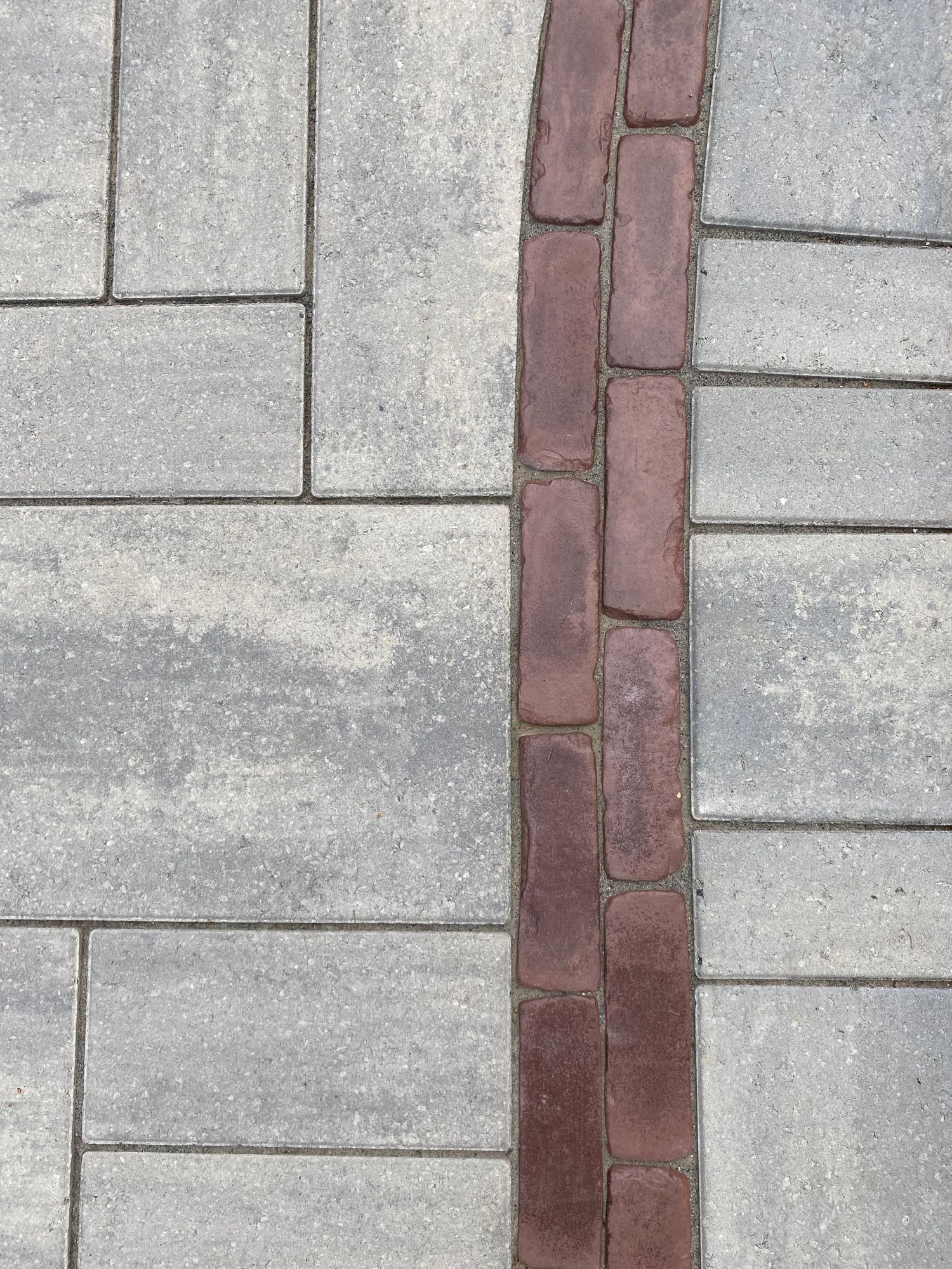 paver walkways with border pattern accent in red and gray